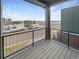 Balcony with black metal railing, outdoor view, and wooden deck at 11267 Central Ct, Broomfield, CO 80021