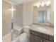Bathroom featuring walk-in shower, white toilet, and vanity with gray cabinet at 11267 Central Ct, Broomfield, CO 80021