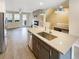 Open concept kitchen with modern island, stainless appliances, and access to living area at 11267 Central Ct, Broomfield, CO 80021
