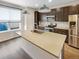 Bright kitchen with a large center island, stainless appliances, and stylish cabinets at 11267 Central Ct, Broomfield, CO 80021