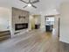 Open living space featuring a modern fireplace and connected kitchen area at 11267 Central Ct, Broomfield, CO 80021