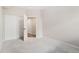Bright bedroom features neutral carpet, an open doorway, and closet with folding doors at 875 E 78Th Ave # 52, Denver, CO 80229