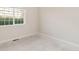 Bedroom with bright neutral carpet and a window allowing natural light at 875 E 78Th Ave # 52, Denver, CO 80229