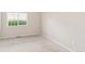 Bedroom featuring a window with outdoor view and neutral carpet at 875 E 78Th Ave # 52, Denver, CO 80229