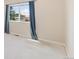 Bright bedroom with a large window and soft blue curtains at 875 E 78Th Ave # 52, Denver, CO 80229