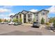 Well-maintained two-story condominium building with stone details at 875 E 78Th Ave # 52, Denver, CO 80229