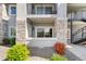 Exterior of building showcasing a well-maintained outdoor space with stone accents at 875 E 78Th Ave # 52, Denver, CO 80229