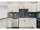 Updated kitchen with stainless steel dishwasher, countertops and backsplash at 875 E 78Th Ave # 52, Denver, CO 80229