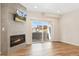 Spacious living room with fireplace and sliding doors to balcony at 875 E 78Th Ave # 52, Denver, CO 80229