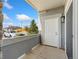Covered patio featuring a white front door and stone accents at 875 E 78Th Ave # 52, Denver, CO 80229