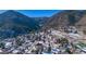 Aerial view of the neighborhood, showing surrounding houses and mountains at 202 Lower Glenway St, Palmer Lake, CO 80133