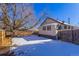 House exterior and snowy backyard view at 202 Lower Glenway St, Palmer Lake, CO 80133