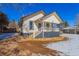 Quaint craftsman home, snowy yard, and mature trees at 202 Lower Glenway St, Palmer Lake, CO 80133