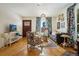 Bright living room with hardwood floors and eclectic decor at 202 Lower Glenway St, Palmer Lake, CO 80133