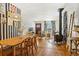 Open living and dining area with wood floors and wood dining table at 202 Lower Glenway St, Palmer Lake, CO 80133