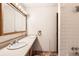 Functional bathroom features a vanity with sink, a tiled shower, and essential fixtures at 7755 E Quincy Ave # 104A6, Denver, CO 80237