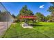 Bright community park featuring covered picnic area with seating and lush green grass at 7755 E Quincy Ave # 104A6, Denver, CO 80237