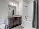 Modern bathroom featuring a granite countertop, vanity, and a shower with a soaking tub at 1841 S Dunkirk St # 101, Aurora, CO 80017
