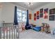 This is a lovely bedroom featuring playful decor, great natural light, and carpeted floors at 1841 S Dunkirk St # 101, Aurora, CO 80017