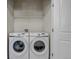 This is a laundry room featuring a washer and dryer at 1841 S Dunkirk St # 101, Aurora, CO 80017