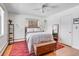 Bright bedroom with a ceiling fan, area rug, natural light and wooden furniture at 1375 N Williams St # 206, Denver, CO 80218