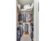 Walk-in closet with clothing racks, shelves, overhead storage, and organized belongings at 1375 N Williams St # 206, Denver, CO 80218