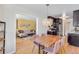 Open-concept dining area connects to the living room and kitchen, complete with stylish chairs and a pendant light at 1375 N Williams St # 206, Denver, CO 80218