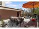 Outdoor patio with dining table, seating, grill, and string lights at 1375 N Williams St # 206, Denver, CO 80218