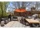 Spacious patio area with ample seating and an umbrella for shade at 1375 N Williams St # 206, Denver, CO 80218