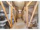 Basement storage area with wood and wire mesh enclosures, and a concrete floor at 1375 N Williams St # 206, Denver, CO 80218