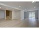 Finished basement features light flooring, recessed lighting, and a sliding glass door at 2253 E 100Th Pl, Thornton, CO 80229