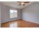 Cozy bedroom with hardwood floors and a large window at 2253 E 100Th Pl, Thornton, CO 80229
