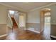 Hardwood floors, staircase and arched entryway make for an inviting living space at 2253 E 100Th Pl, Thornton, CO 80229