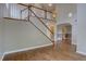 Elegant entryway with hardwood floors, grand staircase, and stylish lighting fixtures for a welcoming ambiance at 2253 E 100Th Pl, Thornton, CO 80229