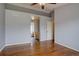 Spacious main bedroom with hardwood floors and arched entry into the en-suite bathroom at 2253 E 100Th Pl, Thornton, CO 80229