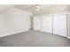 A spacious bedroom with a ceiling fan, closet, and soft carpeting at 235 S 8Th Ave, Brighton, CO 80601