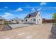 Backyard view of house, concrete pad and garage, and great sun exposure at 235 S 8Th Ave, Brighton, CO 80601