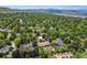 Lush green neighborhood with mature trees and well-maintained homes, offering a serene and picturesque living environment at 2775 Crabapple Rd, Golden, CO 80401