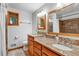 Well-lit bathroom with dual vanities and a walk-in shower at 2775 Crabapple Rd, Golden, CO 80401