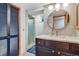 Updated bathroom featuring a stylish vanity, modern lighting, and a shower at 2775 Crabapple Rd, Golden, CO 80401