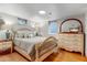 Bright bedroom featuring hardwood floors, large windows, and dresser at 2775 Crabapple Rd, Golden, CO 80401