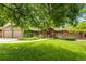 Beautiful single-Gathering home featuring lush landscaping and a two-car garage at 2775 Crabapple Rd, Golden, CO 80401