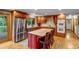 Spacious kitchen with wood cabinetry, stainless steel appliances, and center island at 2775 Crabapple Rd, Golden, CO 80401