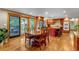 Large kitchen with stainless appliances, kitchen island, and dining area leading to outdoor deck at 2775 Crabapple Rd, Golden, CO 80401