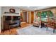 Living room featuring hardwood floors, a grand piano, and natural light from large windows at 2775 Crabapple Rd, Golden, CO 80401