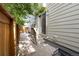 A fenced backyard features a patio, siding, and trees, providing a private and inviting outdoor space at 239 W Jamison Ct, Littleton, CO 80120