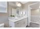 Bright vanity with double sinks and a large mirror at 239 W Jamison Ct, Littleton, CO 80120