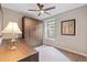 A bedroom featuring a Murphy bed, window, and lamp at 239 W Jamison Ct, Littleton, CO 80120