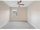 A vacant bedroom with carpet flooring and ceiling fan at 239 W Jamison Ct, Littleton, CO 80120