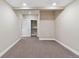 A bright bedroom with neutral paint, carpeted flooring, and open closet creates a welcoming atmosphere at 239 W Jamison Ct, Littleton, CO 80120